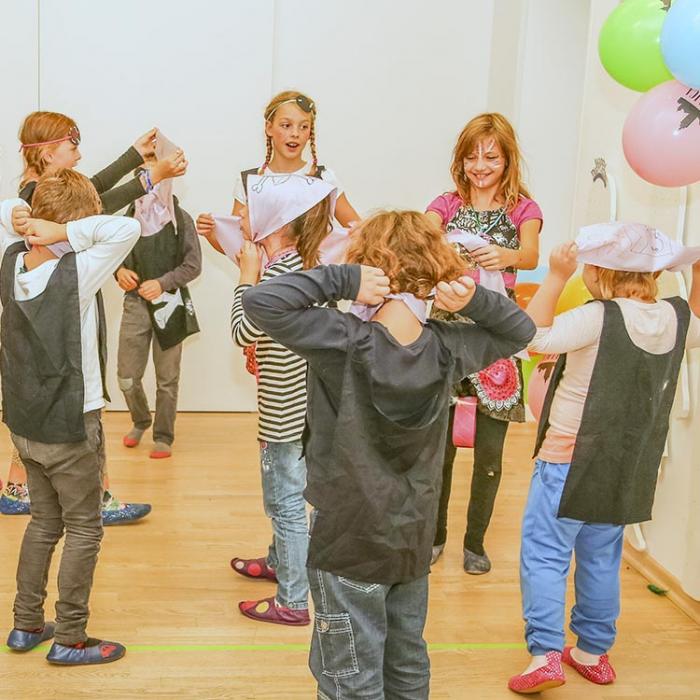 Kids at a party with pirate scarves.