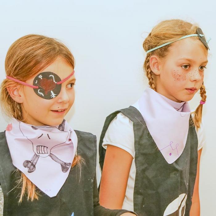 Young little pirate girls at a party.
