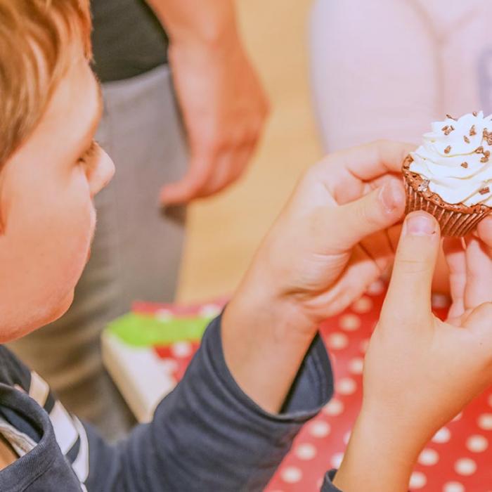 Boy looking at the prepared sweet.