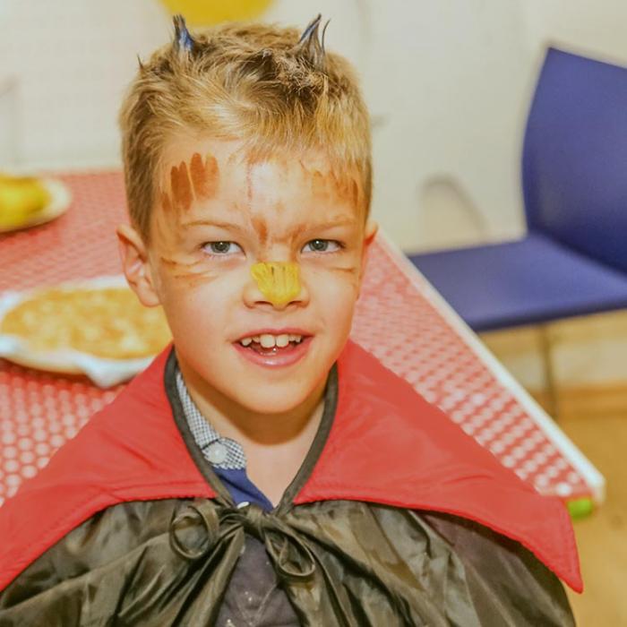 A boy with face painting.