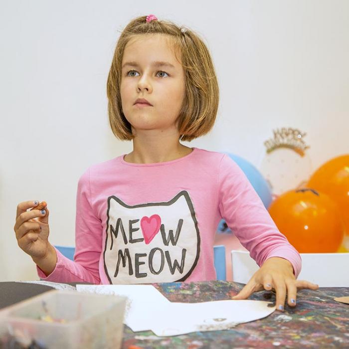 A girl preparing an outfit for a party.